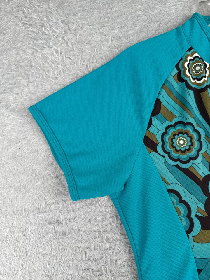 Jersey de ciclismo Shebeest para mujer grande azul azulado estilo años 70 floral 1/2 cremallera poliéster Foto 3 de 4