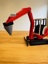 Bruder Bagger Schaeff Kegelspalter Holzspalter Baggerspalter Anbaugerät