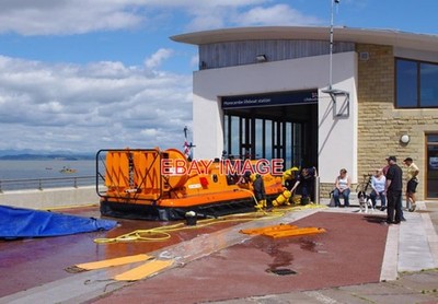 PHOTO  RNLI HOVERCRAFT STATION THE HURLEY FLYER IS GIVEN A FULL VALET OUTSIDE TH