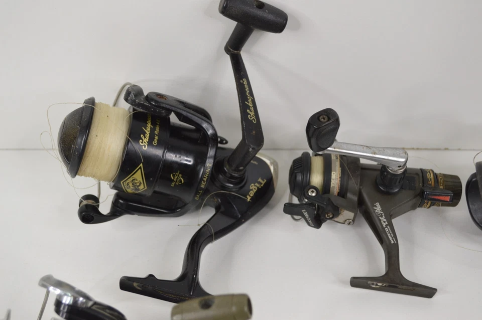 Lot of 14 Fishing Reels FOR PARTS OR REPAIR Pflueger Daiwa Shakespeare Shimano - Image 2 of 4