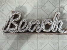 wood and rope beach sign 17 inches long by 6 inches tall