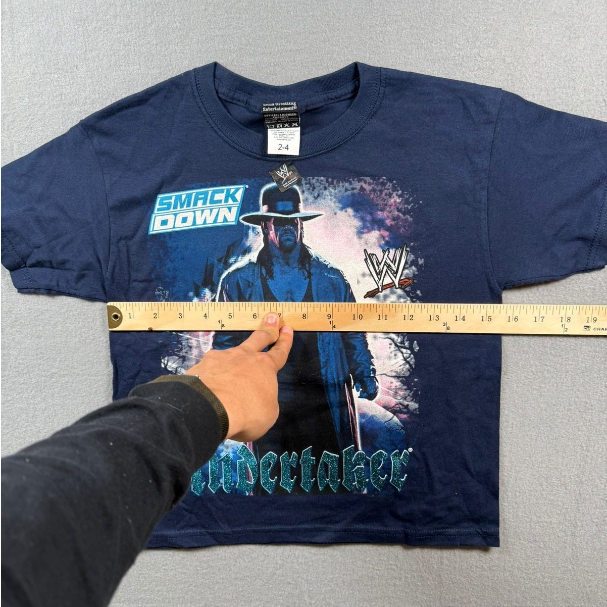 WWE Superstar Graphic Tee – SmackDown Edition | Tag 2-4-Fits Youth S | Navy Blue