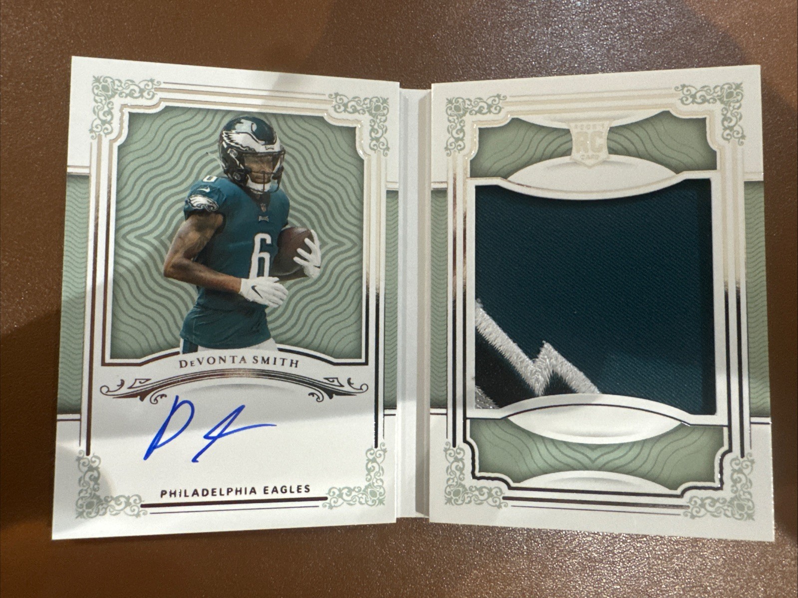 2021 National Treasures DeVonta Smith RC Booklet Patch Auto 77/99 Eagles view 1
