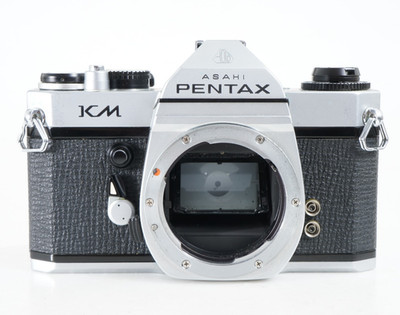 Reflex Argentique Asahi PENTAX KM 35mm + SANGLE/BOUCHON - LIRE/TEL QUEL