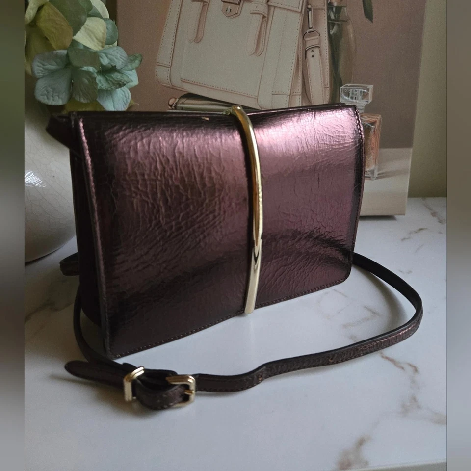 Bolso Clutch Bandolera Nina Ricci Arco Bronce Cuero Borgoña Usado en Excelente Condición Foto 2 de 4