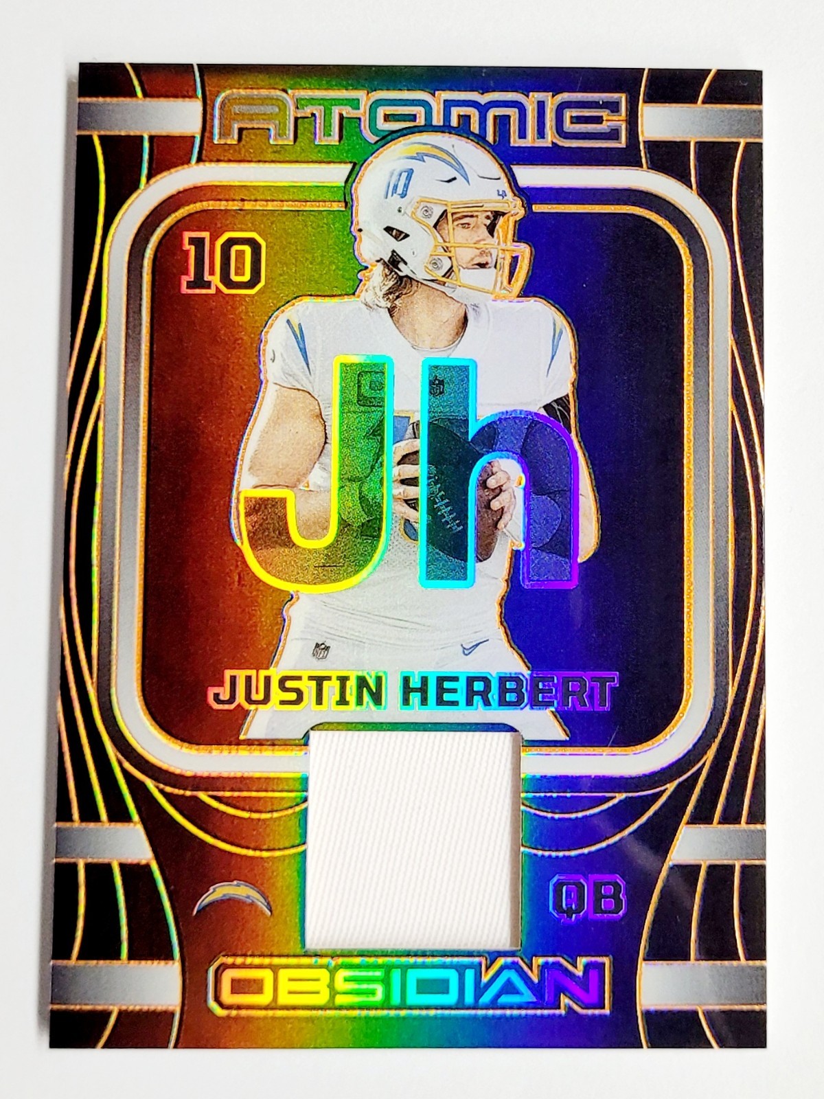 2023 Panini Obsidian Justin Herbert Atomic Orange Electric Etch /49 SP Chargers