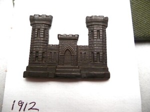Appears to be 1912 Engineer Officer coat insignia