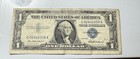 Series 1957 One Dollar Blue Seal Silver Certificate.