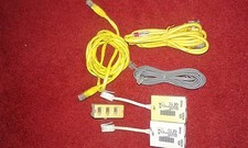 2 YELLOW ETHERNET CABLES/ 1 TRIPLE PHONE ADAPTOR/ 2 IN LINE COMPUTOR TO PHONE CO
