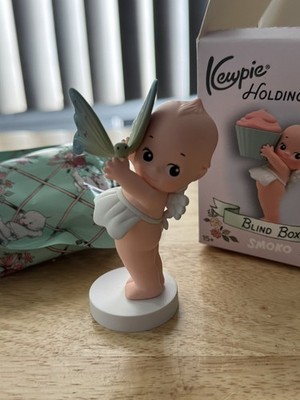 Smoko x Kewpie Holding Things: Kewpie Holds A Butterfly Figure