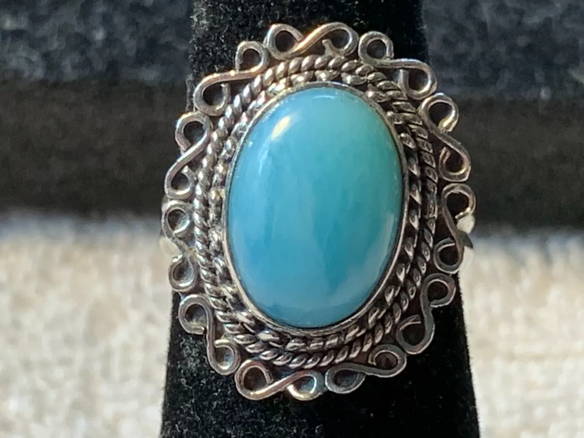 Silver ring with light blue best sale stone