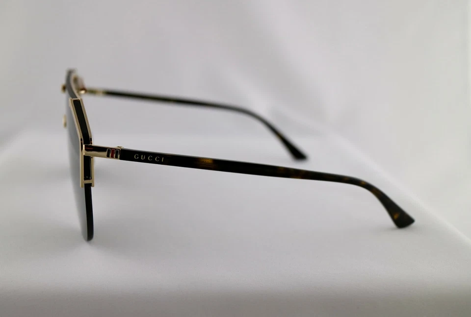 Gafas de sol Gucci GG0584S 002 marco dorado brazos habaneros lentes verdes protector unisex Foto 3 de 4