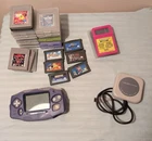 Vintage lot of 24 GB and GBA games with GBA handheld console. 2 accessories.