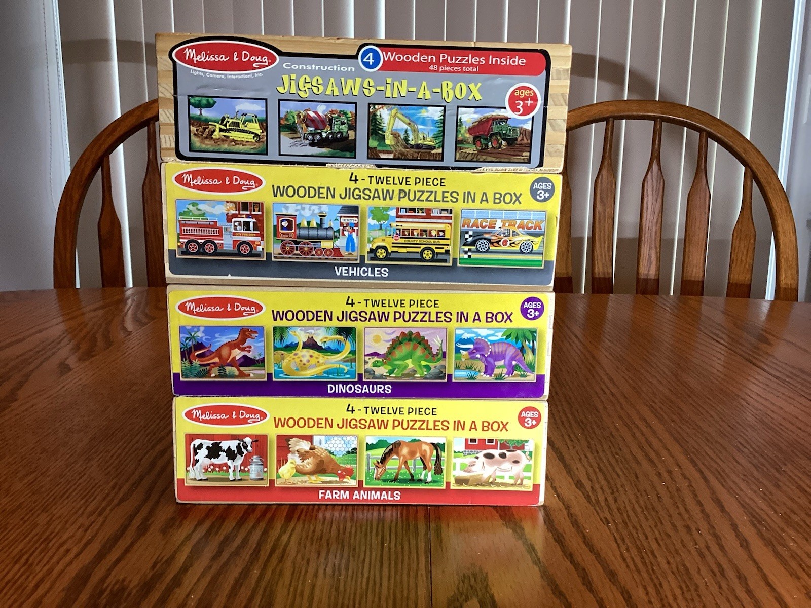 4 Wooden Puzzles in a Box by Melissa and Doug - 4 boxes = 16 puzzles.  Pre owned