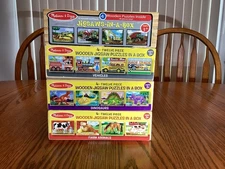 4 Wooden Puzzles in a Box by Melissa and Doug - 4 boxes = 16 puzzles.  Pre owned