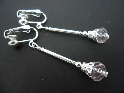 A PAIR OF DANGLY PINK GLASS CRYSTAL SILVER PLATED CLIP ON EARRINGS. - Image 1 of 2