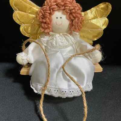 what do they say about dress whites and gold wings Angel with Satin Dress, Wings, & Red Hair Sitting on a Swing. 7