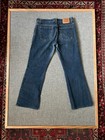 VTG 1990s Levi’s Superlow 518 bootcut jeans, dark wash, waist 31, back view with stitched seams and red Levi’s tag.