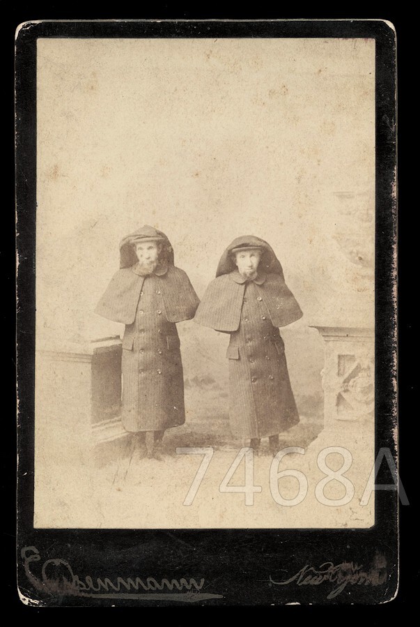 An Eisenmann cabinet photo of the 'Wild Men of Borneo' — a legitimately rare 19th-century sideshow photograph by one of the era's most sought-after circus photographers.