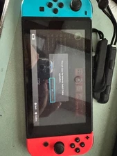 Nintendo Switch with Neon Blue and Neon Red Joy-Con, including zelda/smash bros