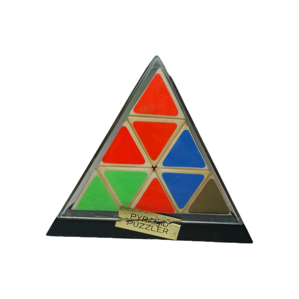 A genuine Taiwan ROC–era Rubik-age mechanical pyramid puzzle still in its original case — a tangible artifact of the early-80s puzzle craze.