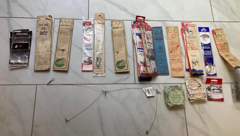 Over 200 Snell Hooks, leaders, one bottom jig, various sizes and test ratings