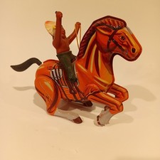 VINTAGE WIND UP TIN INDIAN ON HORSE KORES WORKS TOY RARE