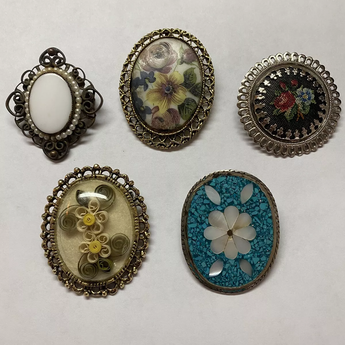 Old brooches and pins top