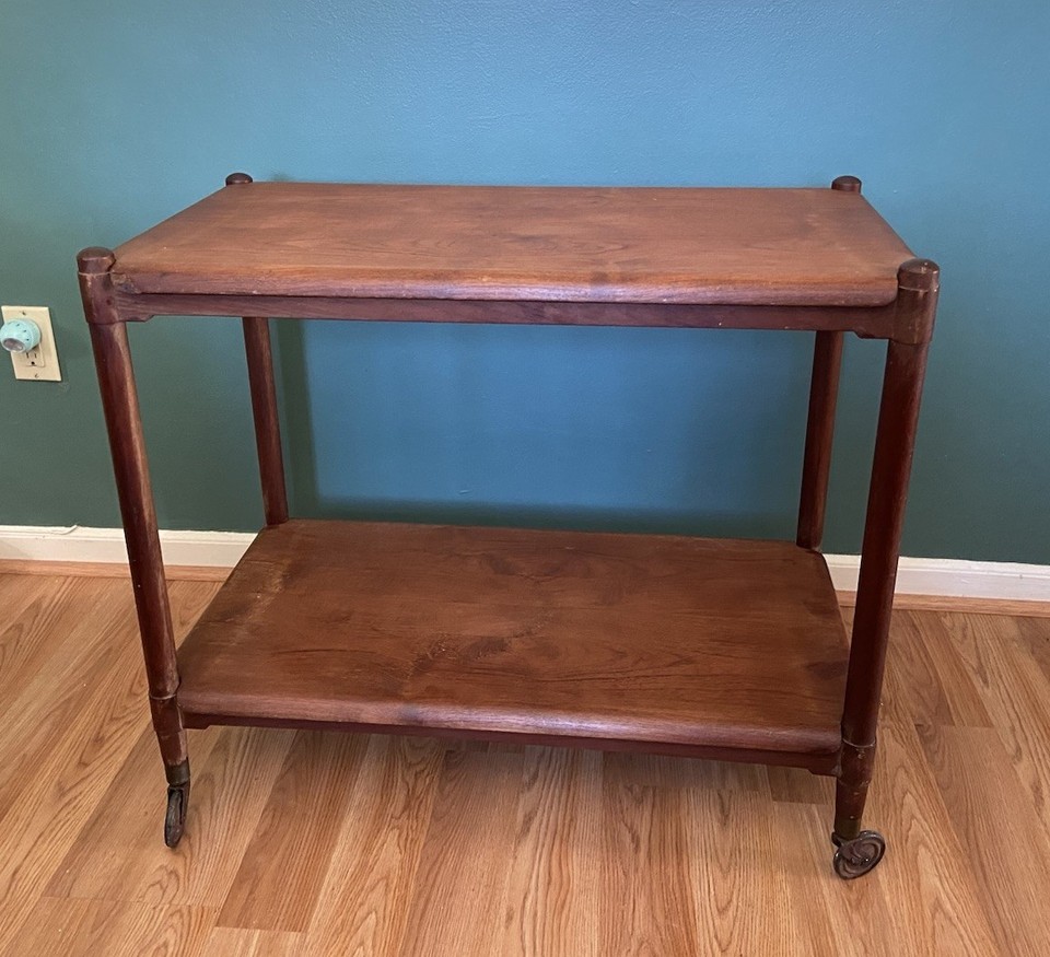 Teak folding butler cart with removable trays — Scandinavian teak barware is peak MCM craftsmanship and the folding butler format is functionally brilliant.