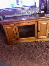 Used Brown wood glass door tv stand height is 2ft by 3ft inches