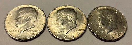 Seven, 1964 Silver Kennedy Half Dollars in AU/XF condition