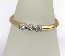 18ct diamond three stone ring, trilogy, estimated 0.09CT, UK N, bezel set. New.