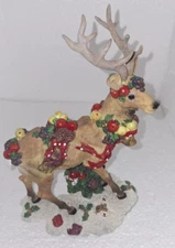 Christmas reindeer figurine 9" tall 6" long. Pre-owned Created by Artmark
