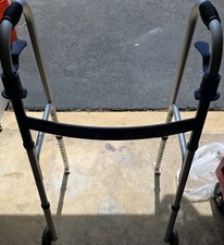 Deluxe, Trigger Release Folding Walker with 5" Wheels Item # 10226 used