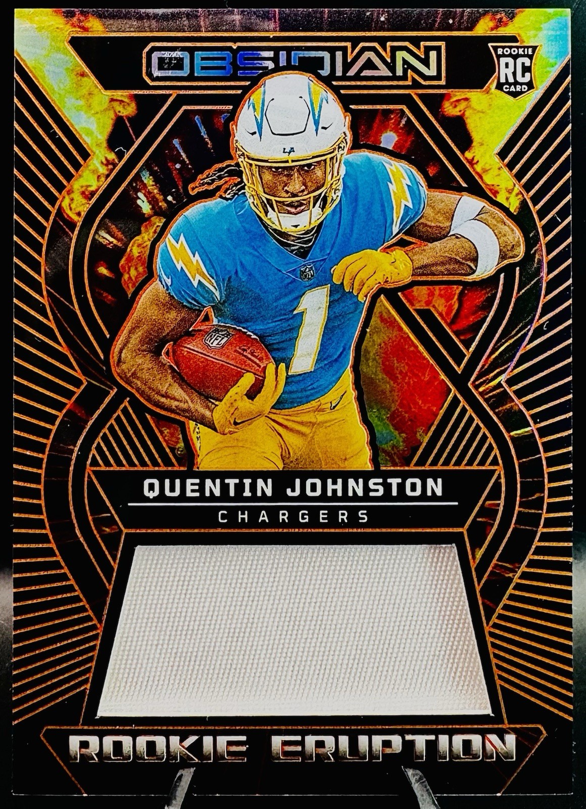 2023 Obsidian Quentin Johnston /49 ORANGE Electric Etch #REM-QJO Chargers RC