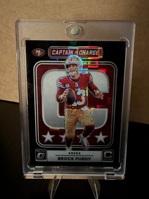 2025 Panini Donruss Optic Captain in Charge Brock Purdy Black Pandora Prizm /149