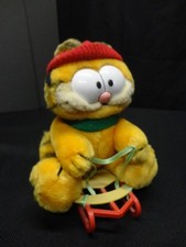 Vintage 1978 Garfield Christmas Sledding Plush 9" sitting on sled. Scarf and Hat