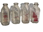 Four (4) Vintage Glass Quart Dairy Bottles - Red Print