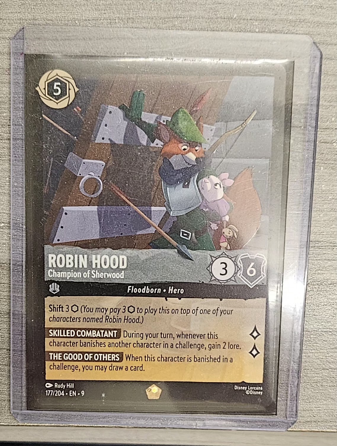 Disney Lorcana Fabled Robin Hood Champion of Sherwood Foil 177/204 NM Legendary