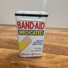 Band-Aid Medicated Tin w/ 20 Sterile Adhesive Bandages, Johnson & Johnson 1984 — photo 1