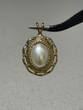 Oval Frosty White Cab Gold Toned Pendant