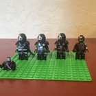 LEGO Minifigure Lot of 4 Black/Gray Armored Figures w/ Helmets & Sword — photo 1
