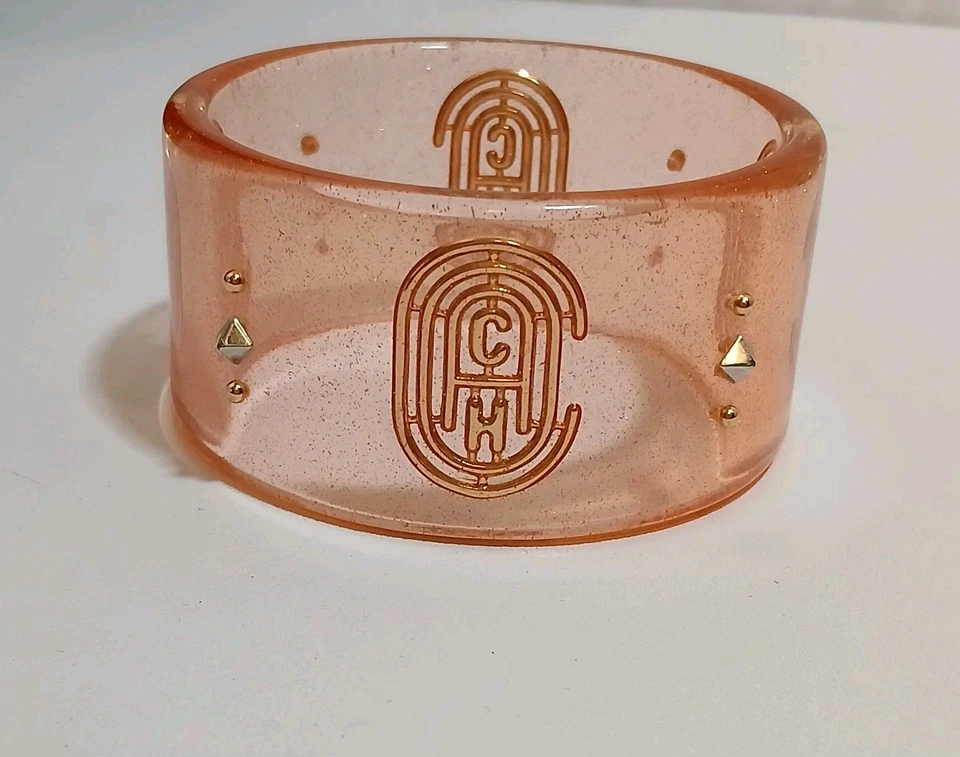 Brazalete Brazalete Coach Retro Signature Translúcido Tono Dorado Lucita *FALTA TACHUELAS Foto 2 de 4