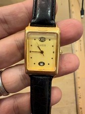 Vintage 1993 Guess vintage gold tone rectangular tank watch black leather band
