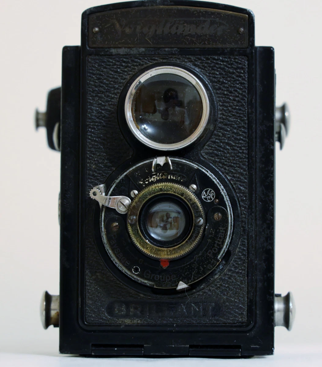 Ancien appareil photo argentique Éclair Lux Box Coronet