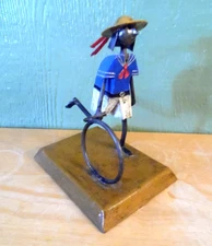 MANUEL FELGUEREZ METAL FOLK ART SCULPTURE YOUNG BOY ROLLING A WHEEL MEXICO