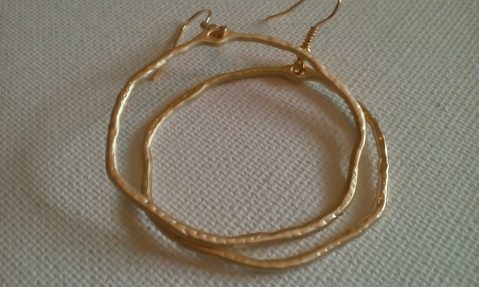 Stylish wonky hoop earrings for a unique, trendy accessory look-image