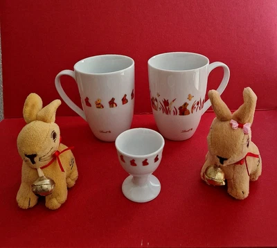 Lindt Oster-Set 5-teilig: 2 Sammeltassen + 1 Eierbecher,  2 Plüsch Goldhasen Neu - Bild 1 von 4