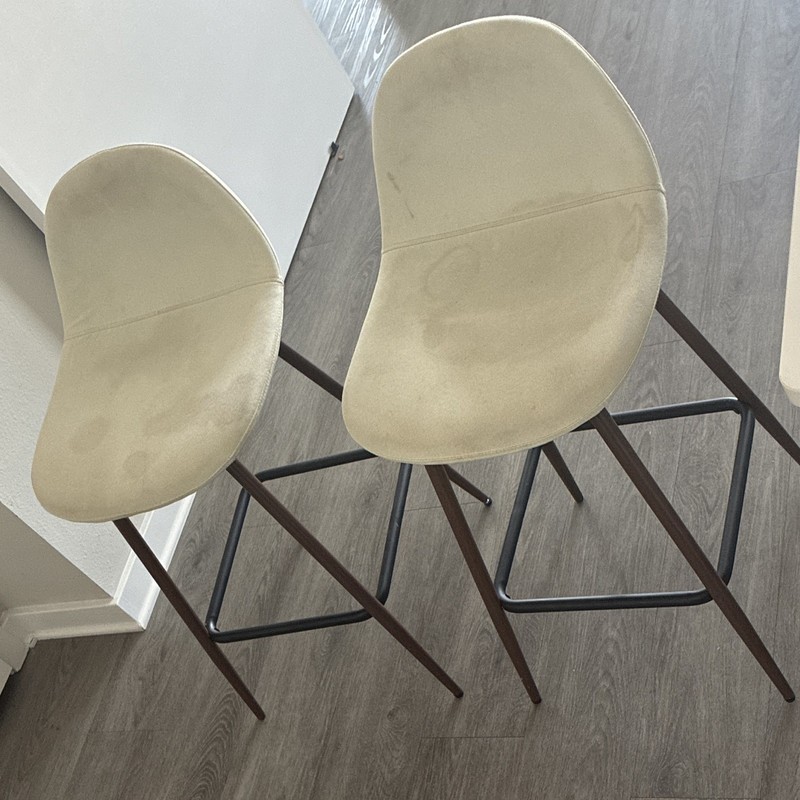 Set of 2 Beige Upholstered Barstools, Dark Wood Legs, Black Metal Footrest