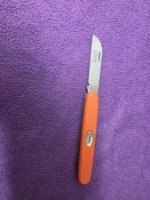 Clauss Titanium folding Knife with orange handles